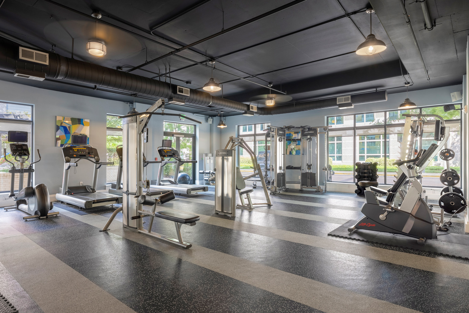 24-hour fitness center with cardio equipment and weight training