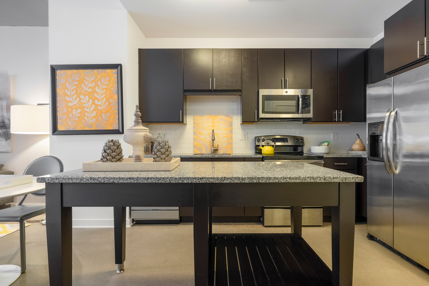 Granite counters and stainless steel appliances give an air of sophistication